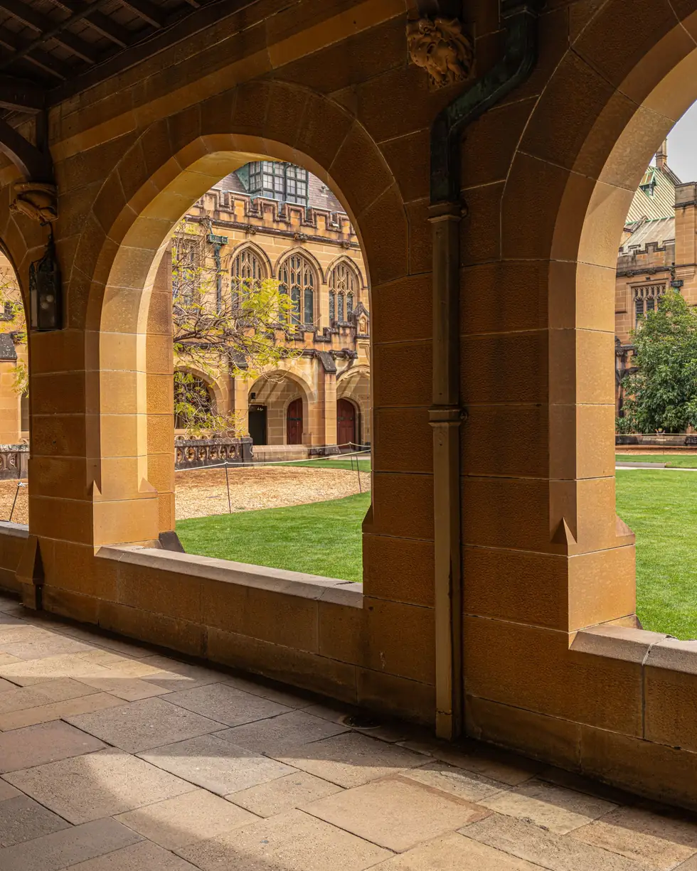 Sandstone archways along a university walkway in Sydney